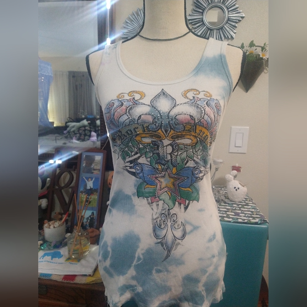 Light blue and white tie-dyed tank top with design.